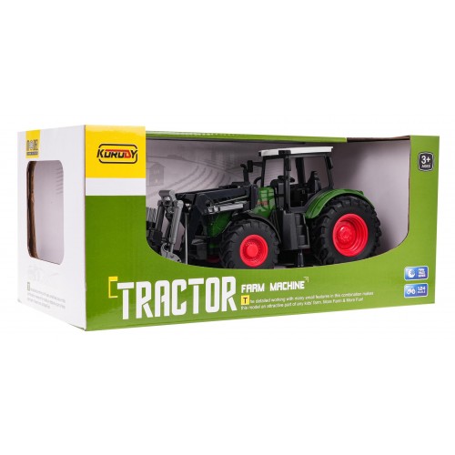 Zelený traktor s drapákom