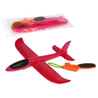 Polystyrénové lietadlo s červeným ručným spúšťačom