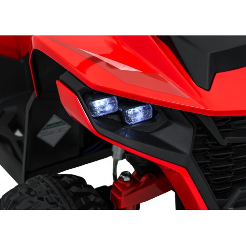 Červené štvorkolkové vozidlo