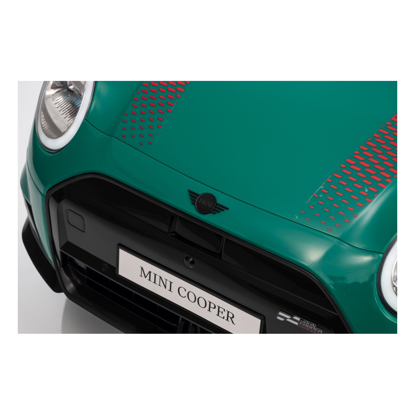 Zelené vozidlo Mini Cooper