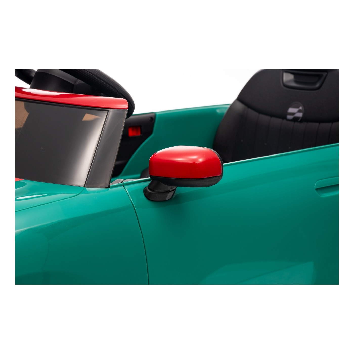 Zelené vozidlo Mini Cooper