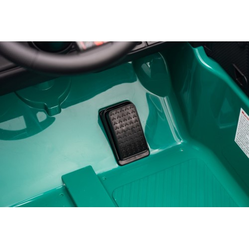 Zelené vozidlo Mini Cooper