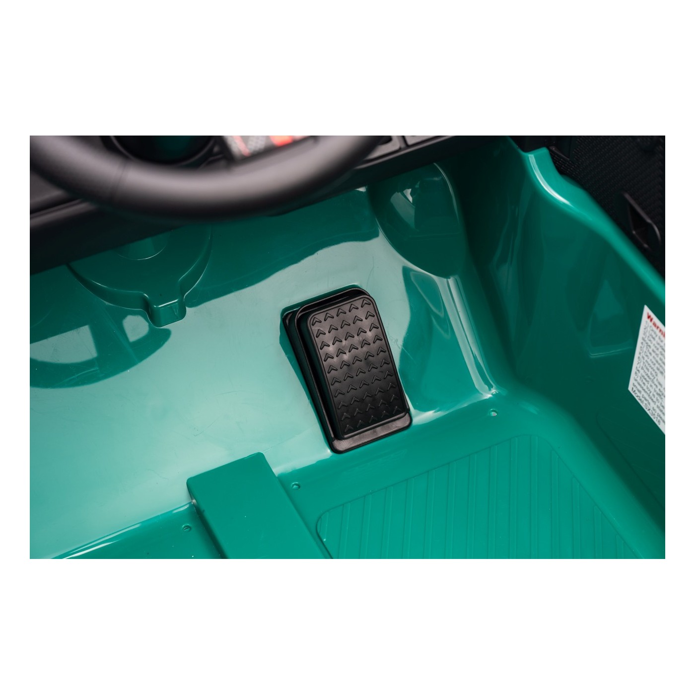 Zelené vozidlo Mini Cooper