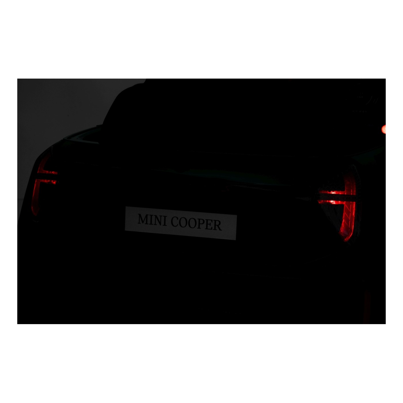 Zelené vozidlo Mini Cooper