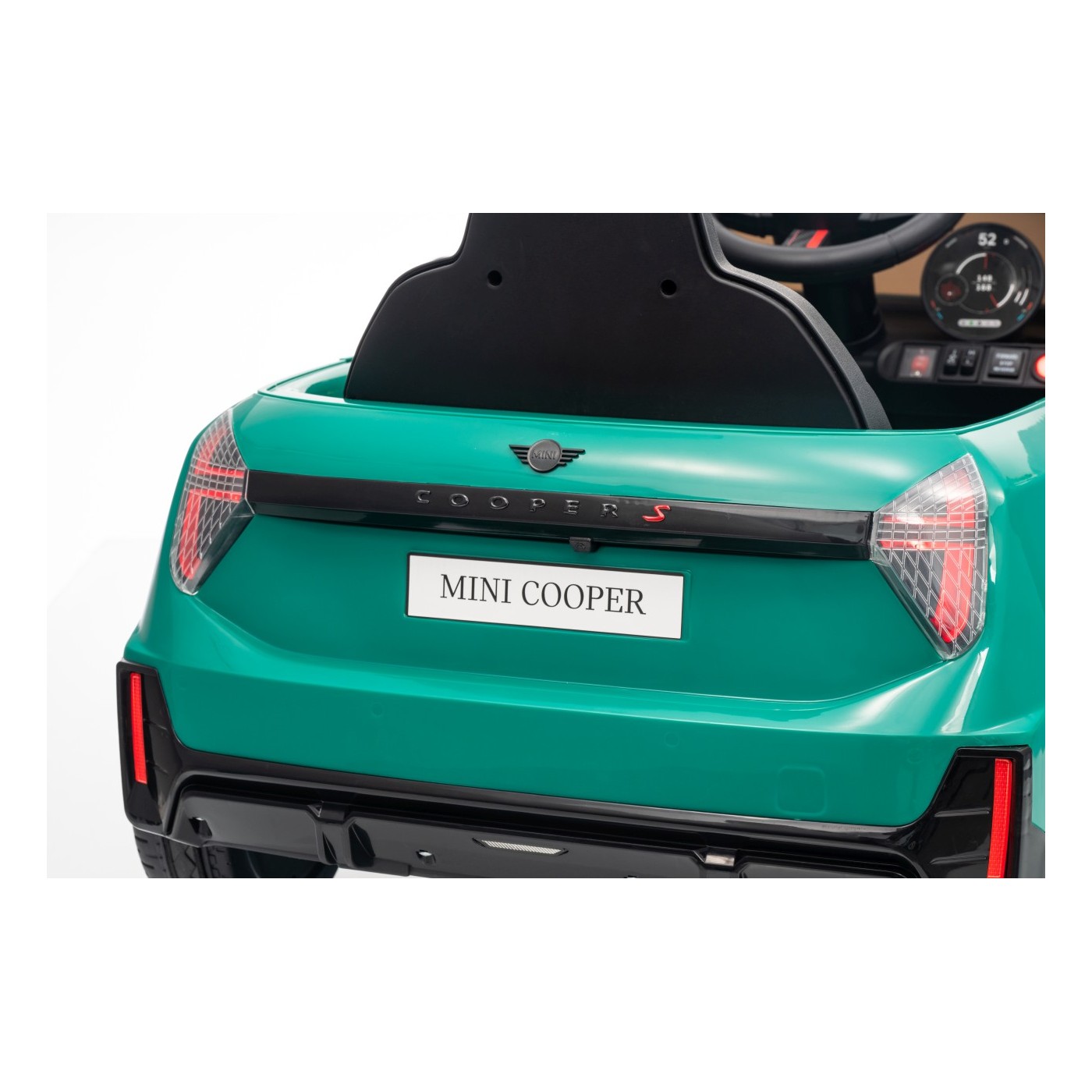 Zelené vozidlo Mini Cooper