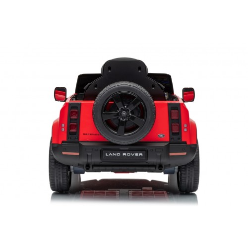 Červené vozidlo Land Rover Defender