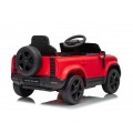 Červené vozidlo Land Rover Defender