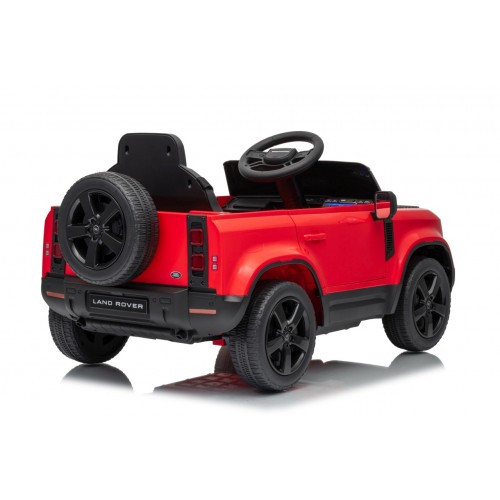 Červené vozidlo Land Rover Defender