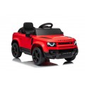 Červené vozidlo Land Rover Defender