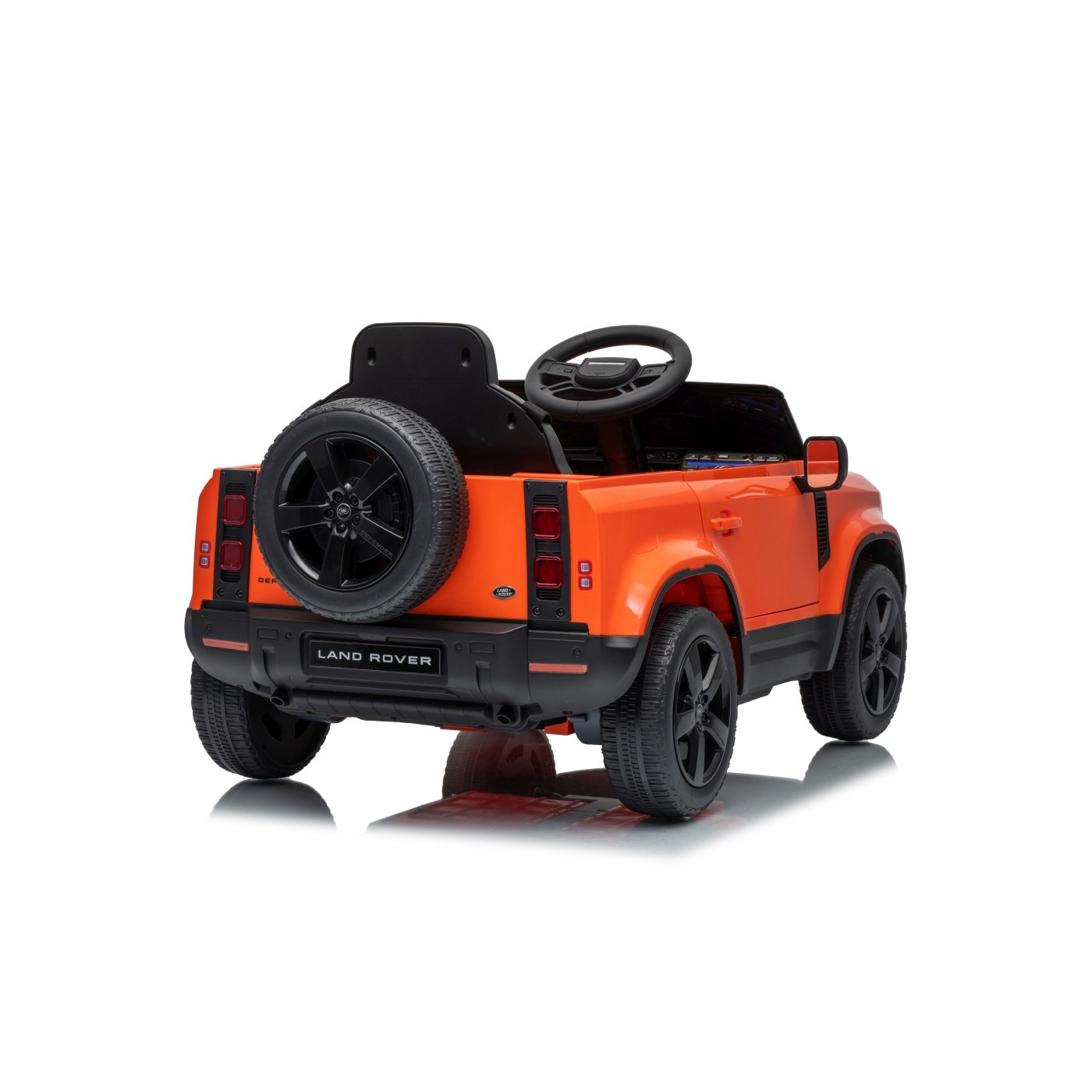 Oranžové vozidlo Land Rover Defender