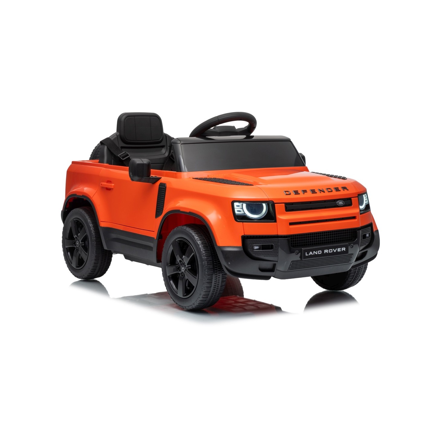 Oranžové vozidlo Land Rover Defender