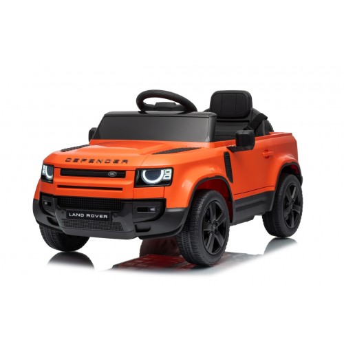 Oranžové vozidlo Land Rover Defender