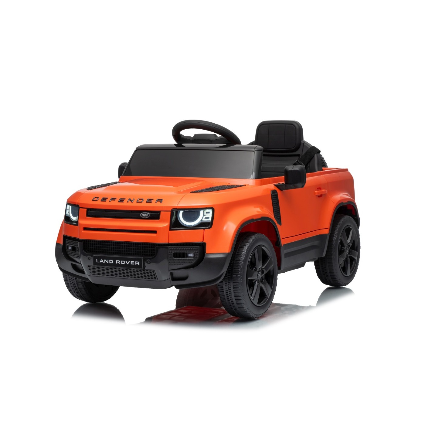 Oranžové vozidlo Land Rover Defender