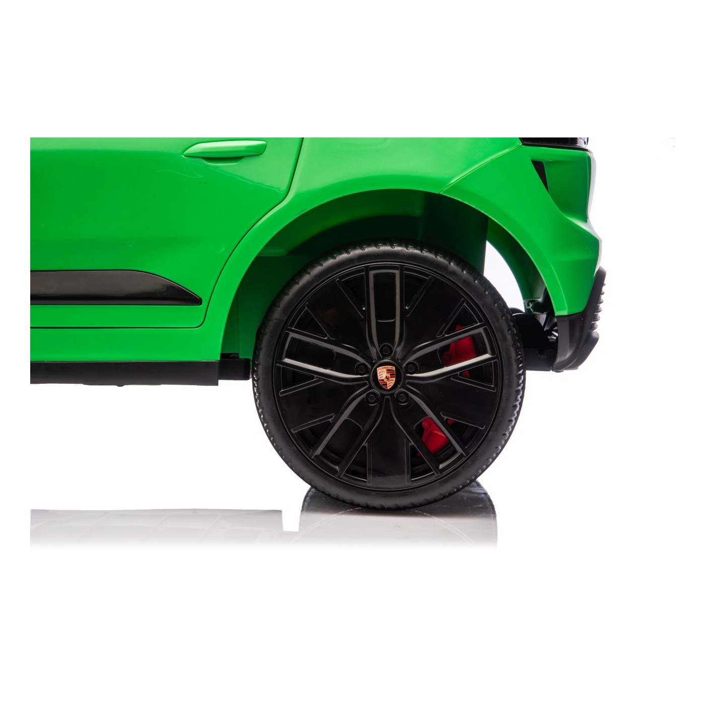 Zelené vozidlo Porsche Macan